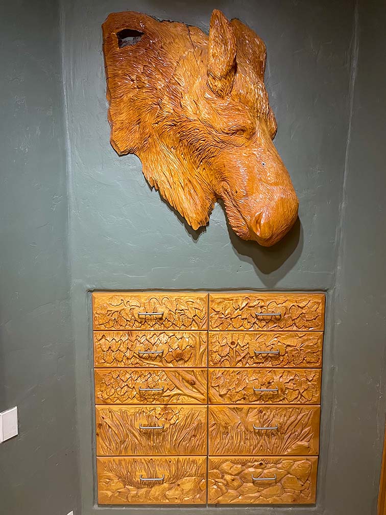 Interior view of the Good Karma Inn showing beautiful hand-carved moose head and drawers